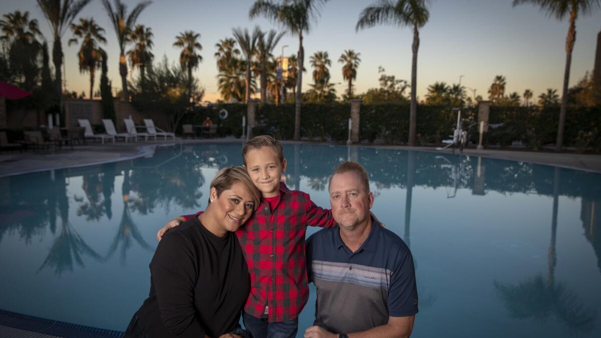 Keith Johnson, Sandra Martinez-Johnson and their son, Javier, 6. The family is moving to Texas after six years in California.