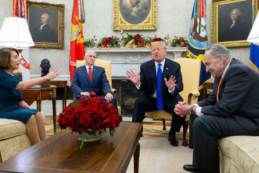 Mandatory Credit: Photo by MICHAEL REYNOLDS/EPA-EFE/REX (10030313x) US President Donald J. Trump (C) and US Vice President Mike Pence (2-L) meet with US House Speaker-designate Nancy Pelosi (L) and US Senate Minority Leader Chuck Schumer (R), in the Oval Office of the White House in Washington, DC, USA, 11 December 2018. Trump, Pelosi and Schumer had a disagreement on border policy and shutting down the government. US President Donald J. Trump meets with US House Speaker-designate Nancy Pelosi and US Senate Minority Leader Chuck Schumer, Washington, USA - 11 Dec 2018 ** Usable by LA, CT and MoD ONLY **