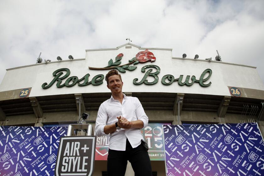 Olympic champion Shaun White poses for photographers after he announced a two-day event called "Air + Style," that will take place in February 2015 at the Rose Bowl in Pasadena.