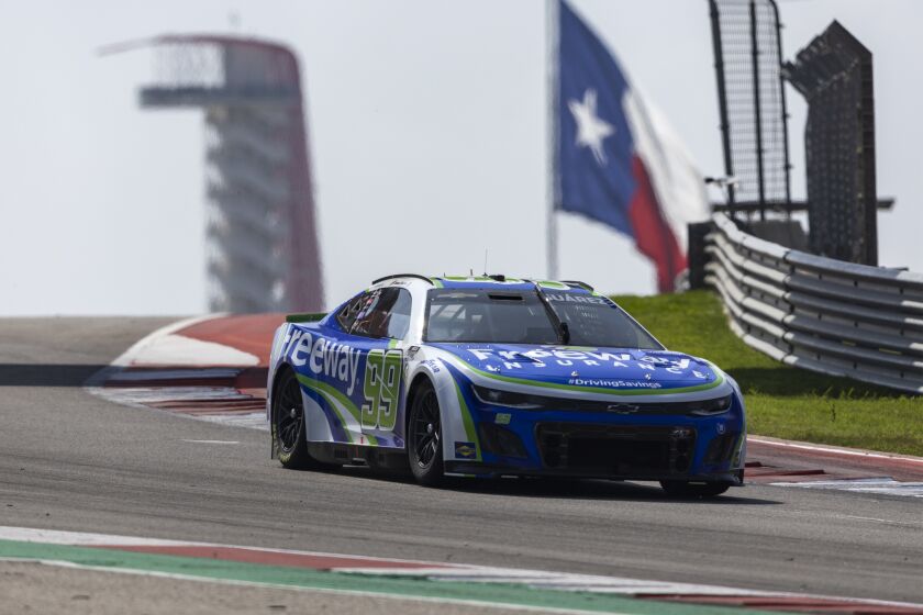 Daniel Suarez (99) steers through Turn 8 during a NASCAR Cup Series auto race at Circuit of the Americas, Sunday, March 26, 2023, in Austin, Texas. (AP Photo/Stephen Spillman)