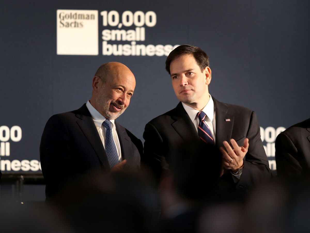 Does Goldman Sachs Chairman and CEO Lloyd Blankfein, left, have your financial interests at heart? Above, Blankfein, left, at an appearance this month with Sen. Marco Rubio (R-Fla.).