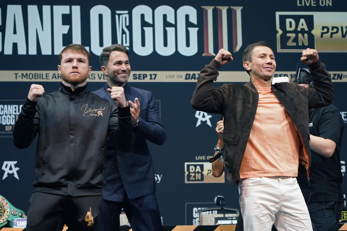 Canelo Alvarez, left, and Gennady Golovkin, right, pose during a news conference Thursday