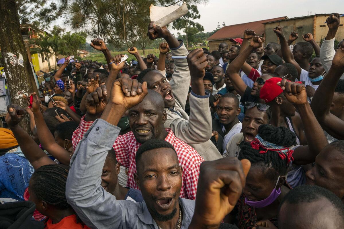 Supporters of leading opposition challenger Bobi Wine cheer 