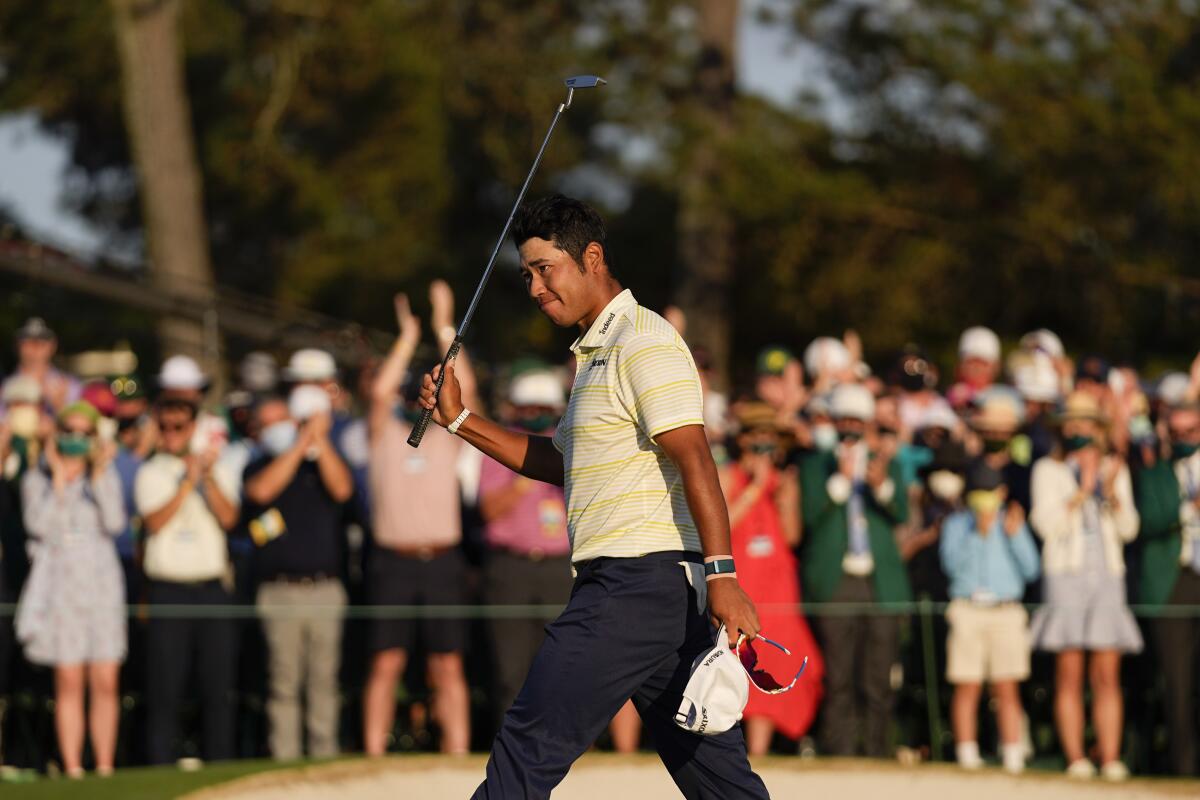 Hideki Matsuyama, of Japan, waves after winning the Masters golf tournament on Sunday, April 11, 2021, in Augusta, Ga. (AP Photo/Matt Slocum)