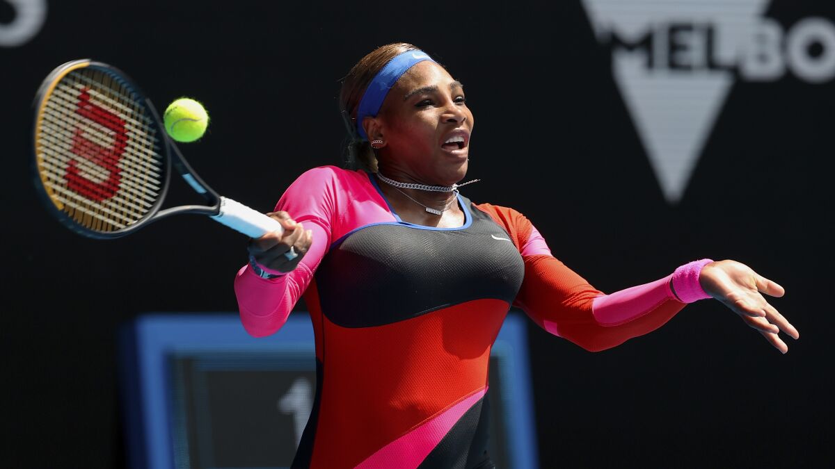 Serena Williams hits a forehand return during her victory over Aryna Sabalenka at the Australian Open on Sunday.
