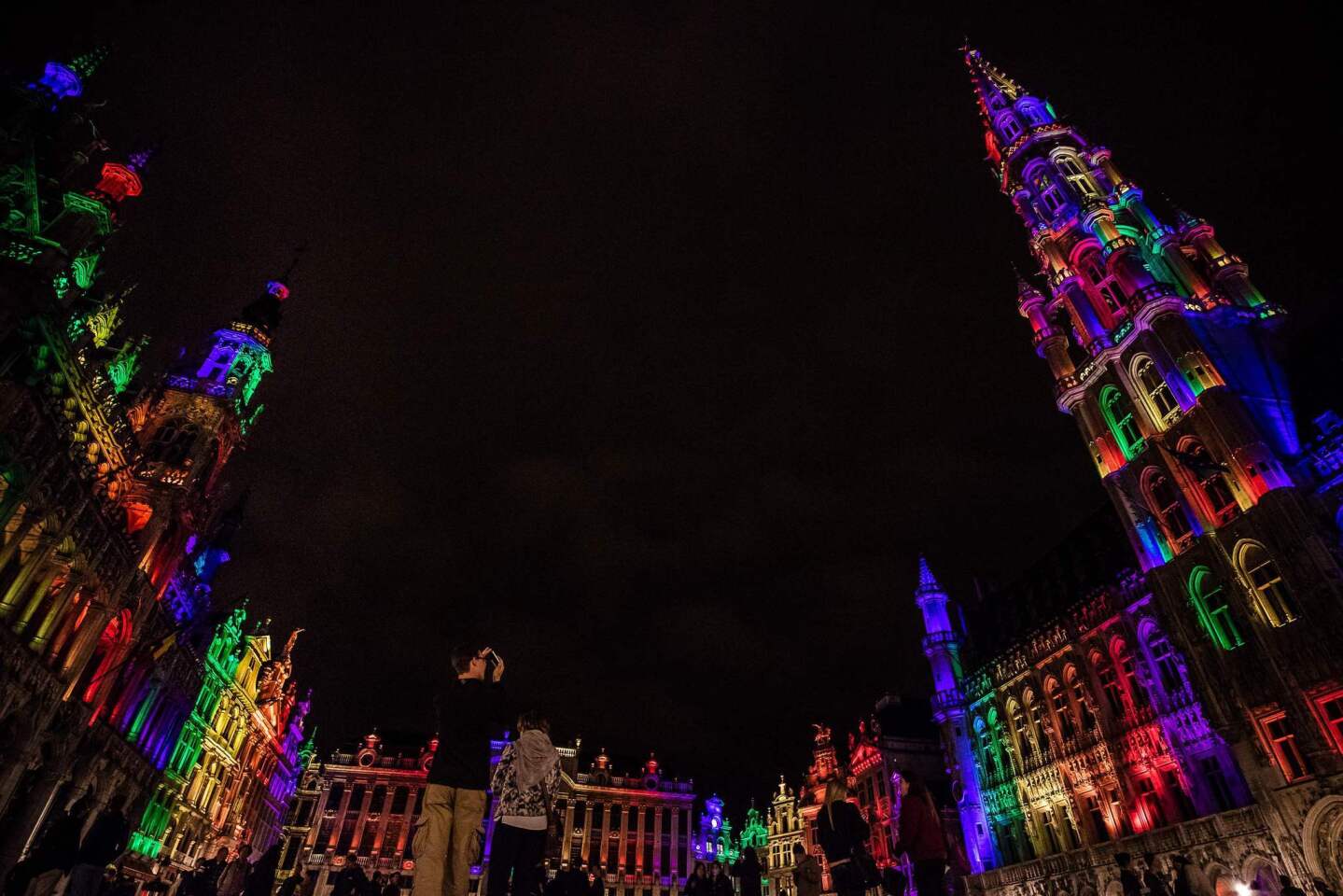 The city hall and the heritage buildings on the Brussels Grand Place/Grote Markt are showered in the colors of the LGBT rainbow flag June 13, 2016 in support of the victims of the Orlando shooting.