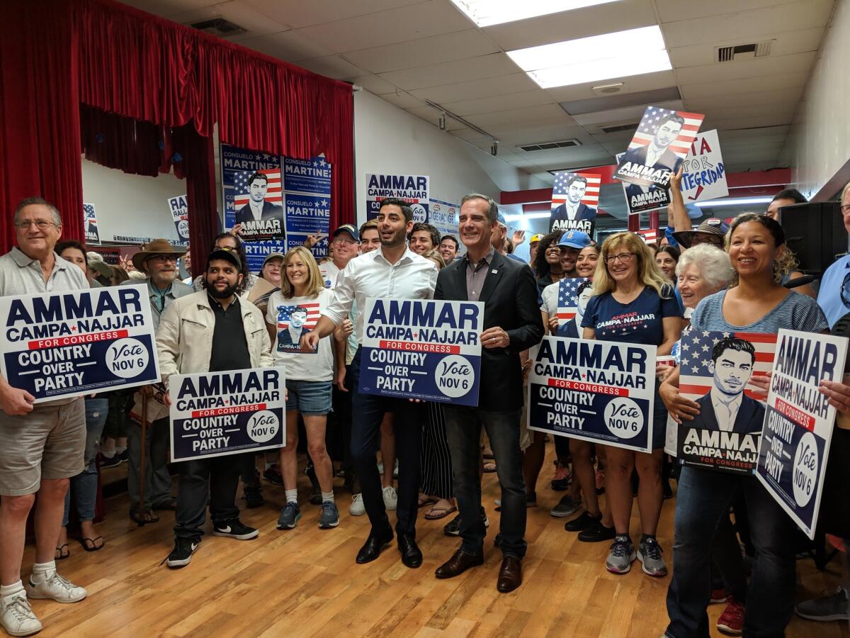 Democratic candidate Ammar Campa-Najjar fires up volunteers with L.A. Mayor Eric Garcetti in Escondido on Saturday.