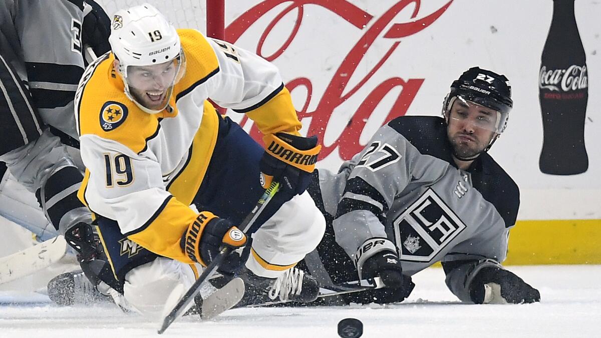 Kings' Alec Martinez has surgery on wrist cut by skate