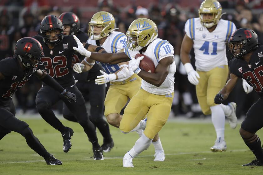 UCLA's Demetric Felton (10) carries against Stanford during the first half of an NCAA college football game Thursday, Oct. 17, 2019, in Stanford, Calif. (AP Photo/Ben Margot)