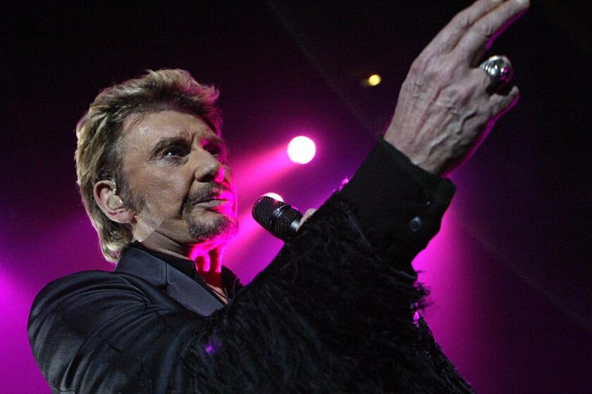 (FILES) This file photo taken on December 6, 2003 shows French singer Johnny Hallyday performing on stage in Clermont-Ferrand. France's best-known rock star Johnny Hallyday has died aged 74 after a battle with lung cancer, his wife Laeticia told AFP on December 6, 2017. / AFP PHOTO / THIERRY ZOCCOLANTHIERRY ZOCCOLAN/AFP/Getty Images ** OUTS - ELSENT, FPG, CM - OUTS * NM, PH, VA if sourced by CT, LA or MoD **