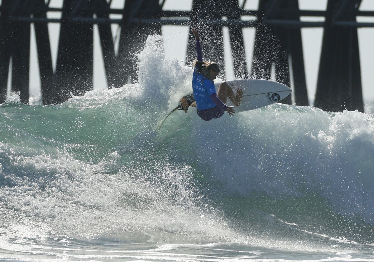 Sawyer Lindblad surfs on her way to winning the Nissan Super Girl Surf Pro at the Oceanside Pier.
