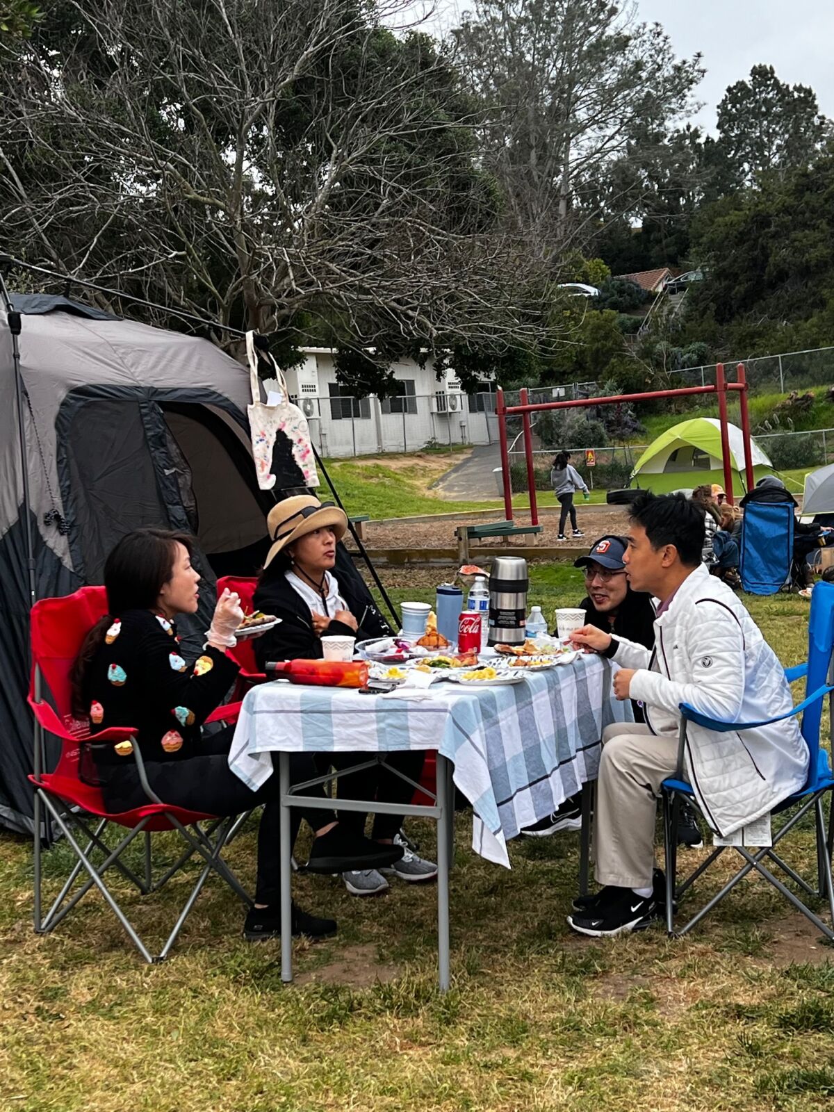 A family enjoys camping out.