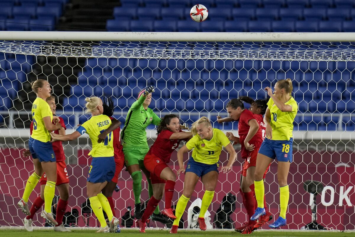 Canada's goalkeeper Stephanie Labbe blocks a shot in the women's soccer match for the gold medal against Sweden at the 2020 Summer Olympics, Friday, Aug. 6, 2021, in Yokohama, Japan. (AP Photo/Fernando Vergara)