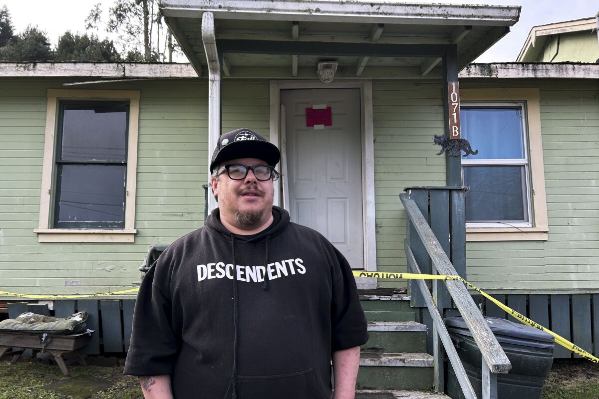 Kevin Mcniece stands outside of his earthquake-damaged home in Rio Dell, Calif.
