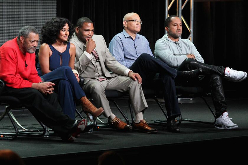 From left, actors Laurence Fishburne, Tracee Ellis Ross, Anthony Anderson, executive producer Larry Wilmore and creator/executive producer Kenya Barris speak onstage at the "Black-ish" panel.