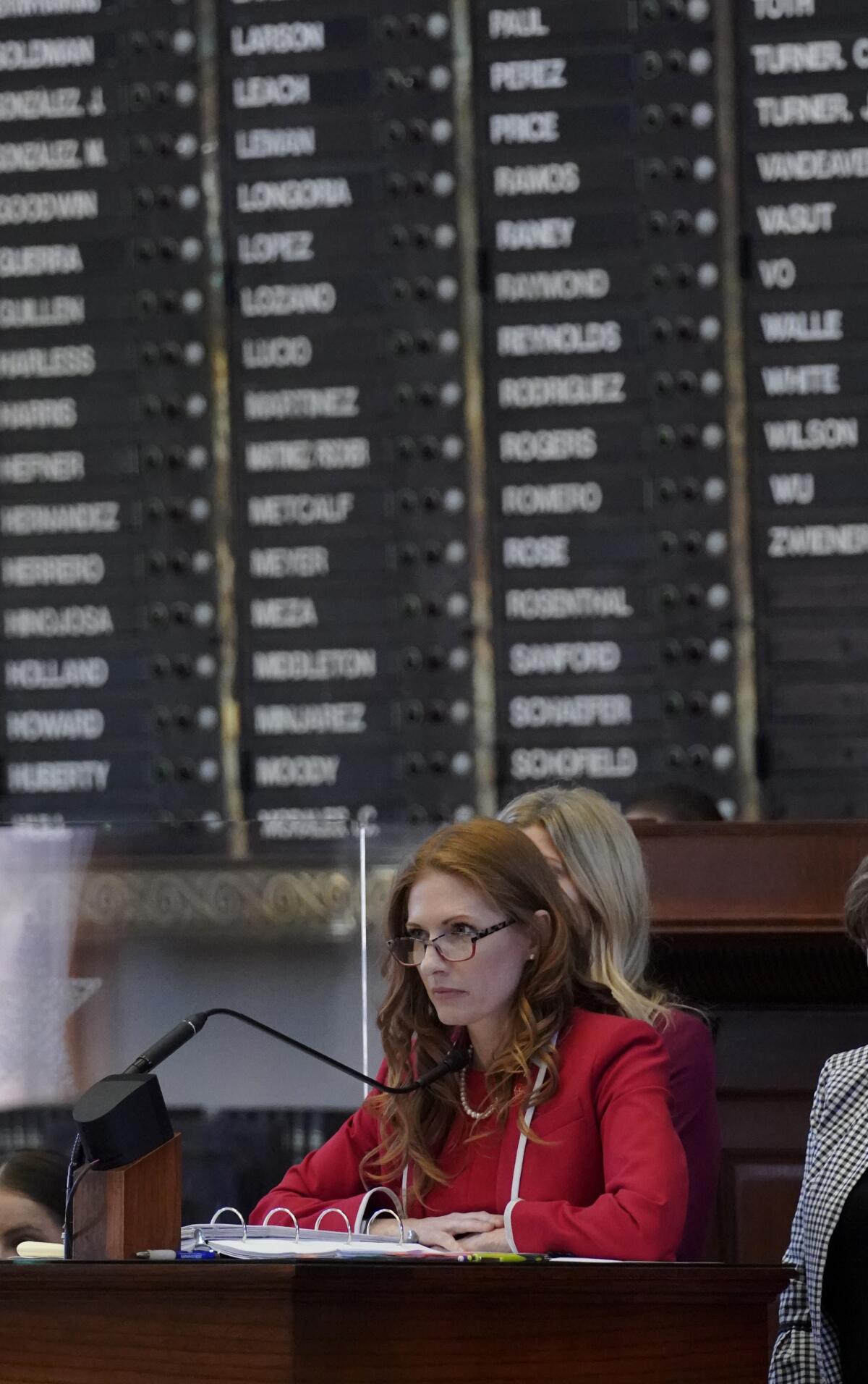 Texas State Rep. Shelby Slawson, R-Stephenville, center, answers questions about a proposed bill in the House Chamber, Wednesday, May 5, 2021, in Austin, Texas. Slawson is co-sponsoring a bill introduced in Texas that would ban abortions as early as six weeks and allow private citizens to enforce it through civil lawsuits, under a measure given preliminary approval by the Republican-dominated state House on Wednesday. The move would have Texas join about a dozen other Republican-led states to pass so-called "heartbeat bills" which have been mostly blocked by federal courts. (AP Photo/Eric Gay)