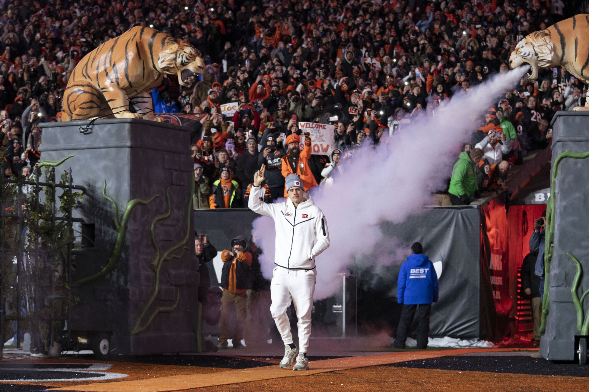 Bengals quarterback Joe Burrow waves to adoring fans during a Super Bowl LVI rally in Cincinnati on Monday.
