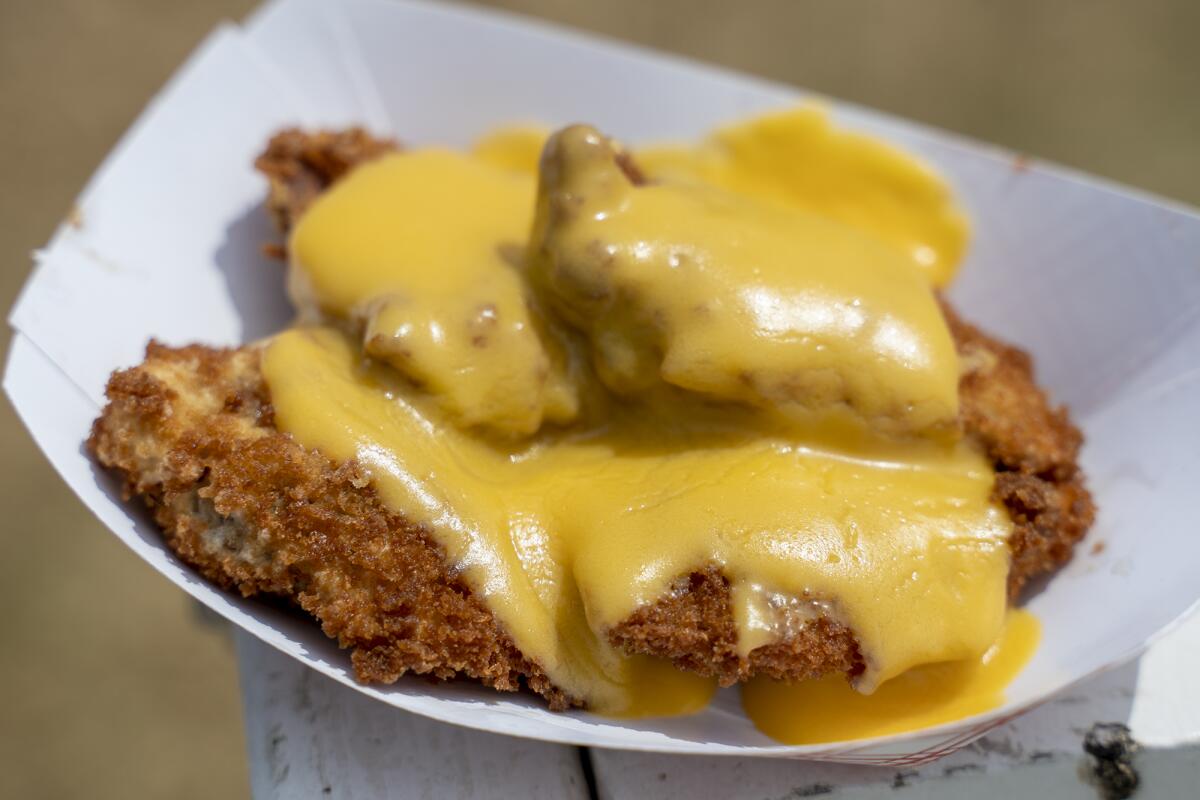 The spicy hot dog bites with nacho cheese from Pink's at the O.C. Fair's $3 "Taste of Fair" on Thursday.
