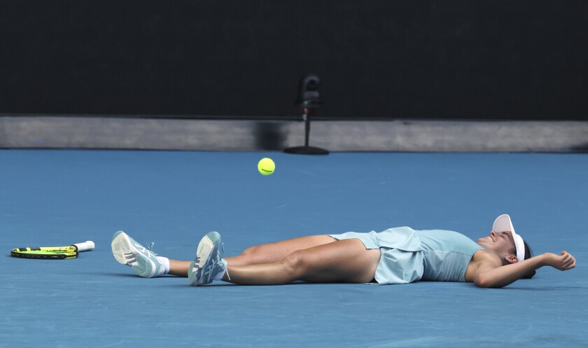 Jennifer Brady lies on the court after defeating Karolina Muchova in the semifinals.