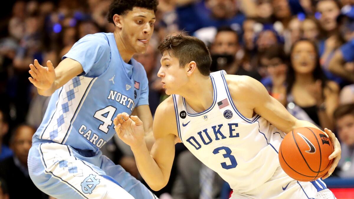 Duke guard Grayson Allen drives to the basket against North Carolina forward Justin Jackson during their game Thursday night.