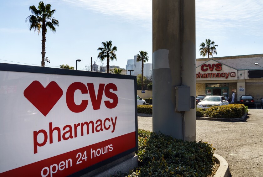 FILE - In this Wednesday, Feb. 3, 2021 file photo, a CVS pharmacy is seen in Los Angeles. CVS Health Corporation (CVS) on Tuesday, Feb. 16 reported a fourth-quarter net income of $973 million. (AP Photo/Damian Dovarganes, File)