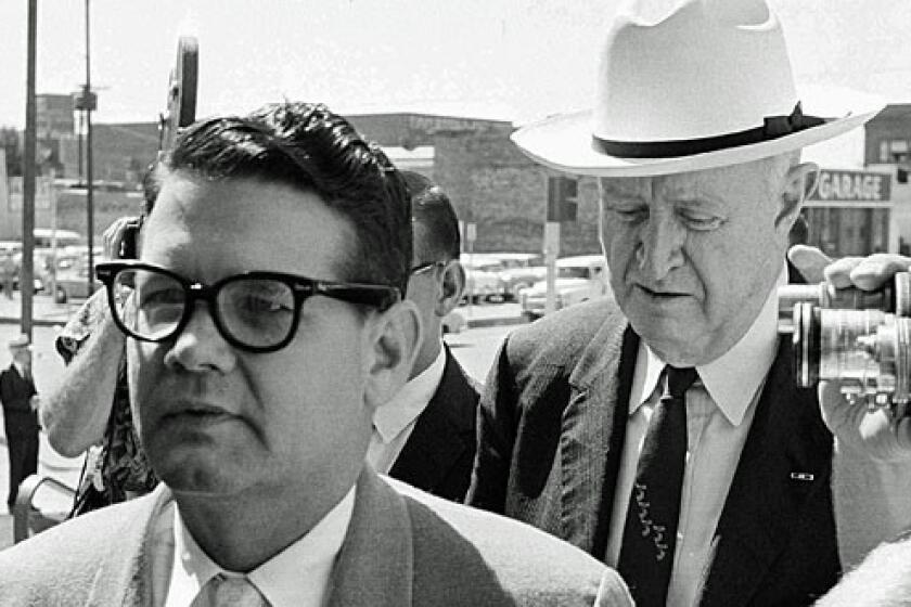 In this 1962 file photo, Billie Sol Estes, left, and his attorney, John Cofer, are shown arriving at the federal court house in El Paso.
