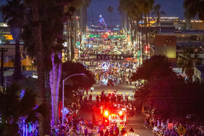 Newport Avenue lights up all the way to the sea for the Ocean Beach Holiday Parade on Dec. 4.