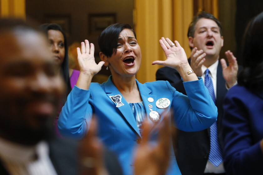 FILE - In this Jan. 8, 2020 file photo Virginia Del. Hala Ayala, D-Prince William County, reacts to the remarks during opening ceremonies of the 2020 Virginia General Assembly at the Capitol in Richmond, Va. Ayala won the Democratic nomination for Lt. Governor and will face Republican Winsome Sears in the November 2021 election. (AP Photo/Steve Helber, File)