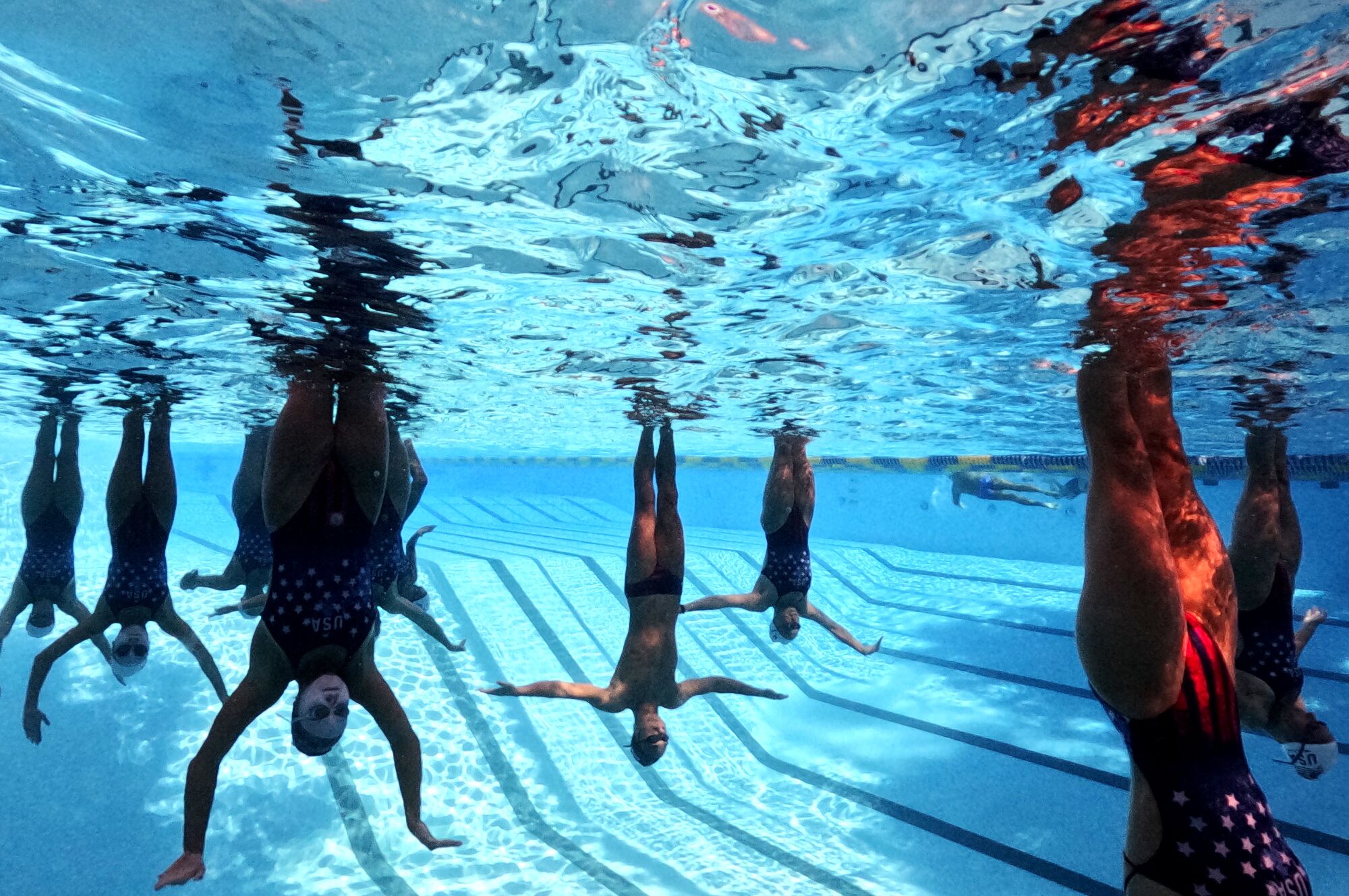 The U.S. Artistic Swimming team takes part in a recent practice at UCLA.