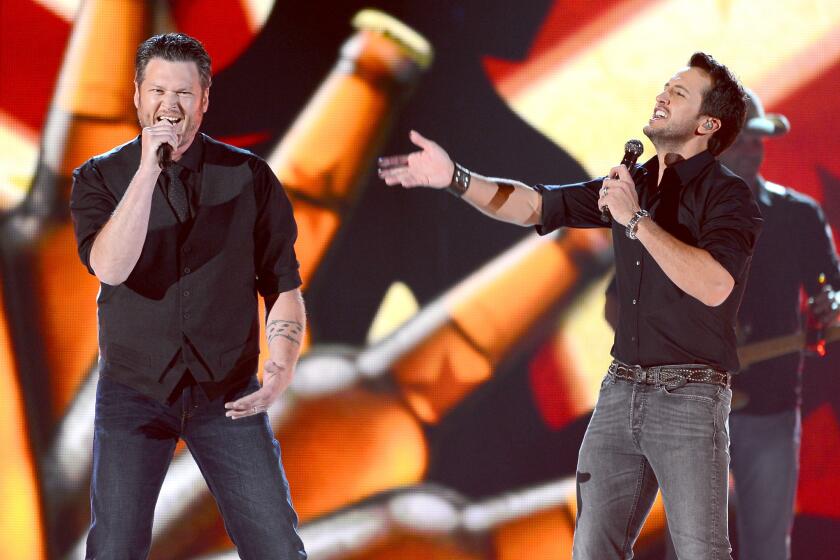 Last year's hosts Blake Shelton, left, and Luke Bryan are set to again lead the awards show April 6, part of a weeklong salute to country music.