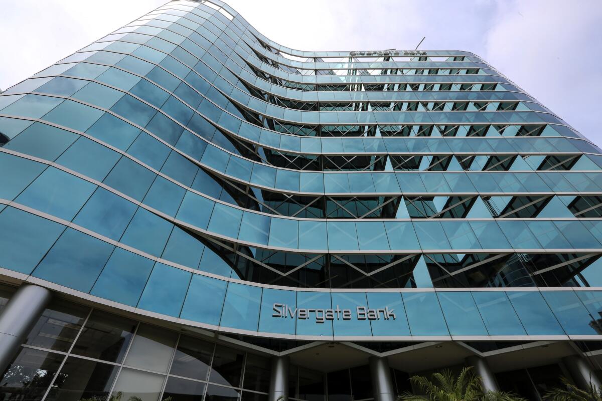 A multistory building with the words Silvergate Bank on its front. 