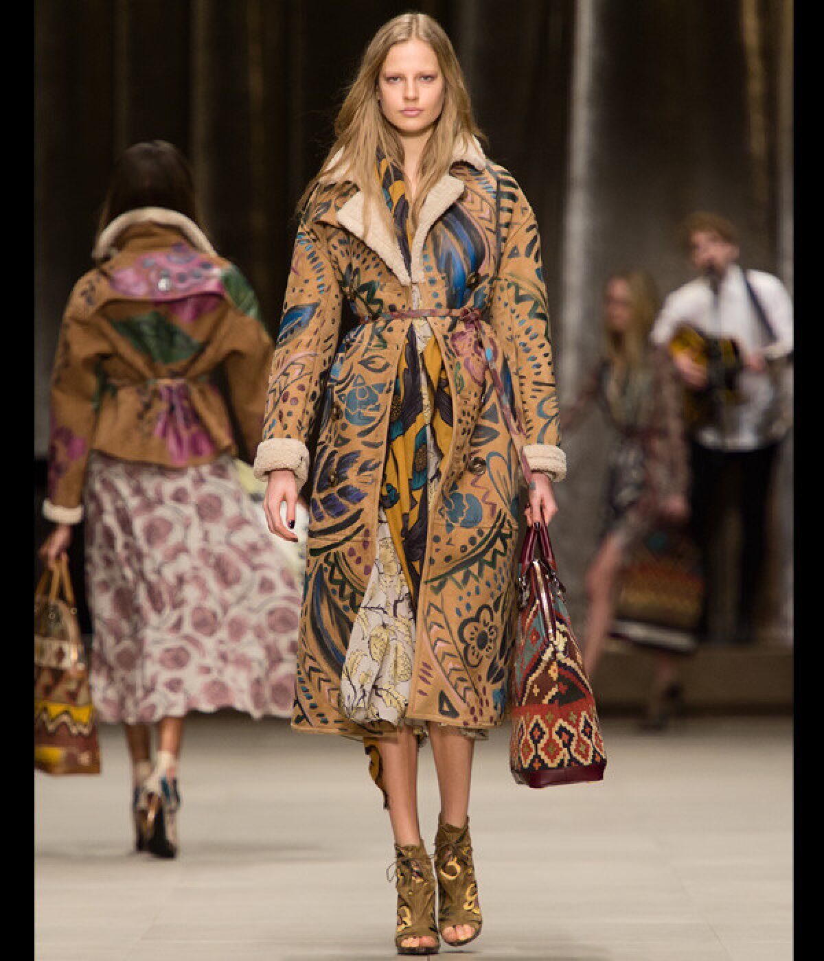Burberry Prorsum hand-painted bonded sheepskin trench coat and panelled floral-print silk georgette dress.