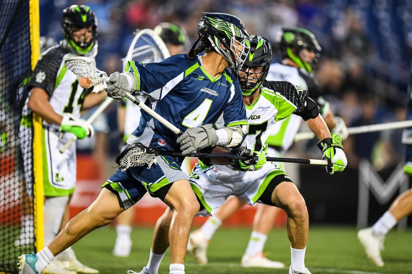 Chesapeake Bayhawks attack Lyle Thompson (4) brings the ball across the field during the first quarter against the New York Lizards at Navy-Marine Corps Memorial Stadium.