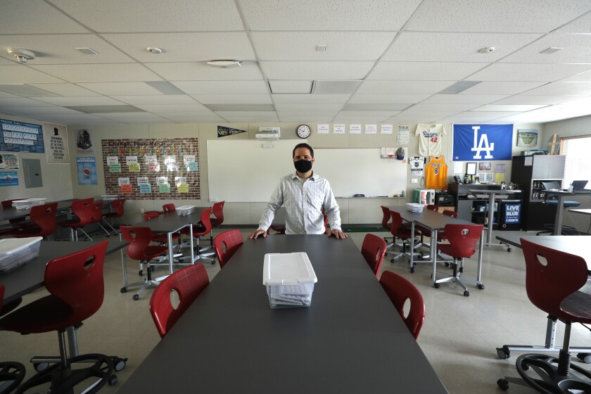 Sean Brandlin, an eighth grade social studies teacher at El Segundo Middle School, stands in his classroom.