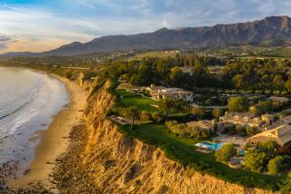 Crawling across 22 acres of oceanfront bluffs, the estate includes two custom homes that combine for 14,000 square feet.