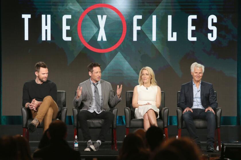 Actors Joel McHale, David Duchovny, Gillian Anderson and creator/executive producer Chris Carter speak onstage during "The X-Files" panel discussion.