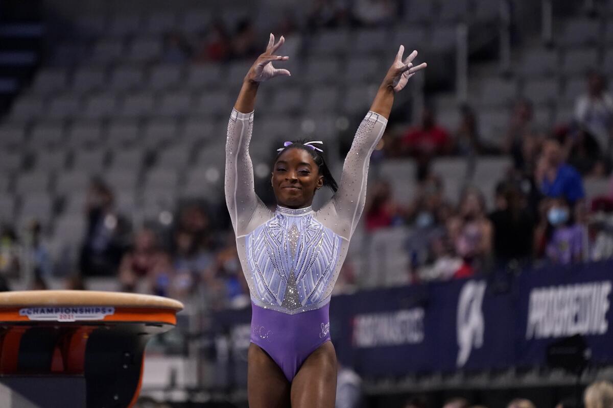 Simone Biles competes in the vault exercise during the U.S. Gymnastics Championships, Friday, June 4, 2021, in Fort Worth, Texas. (AP Photo/Tony Gutierrez)