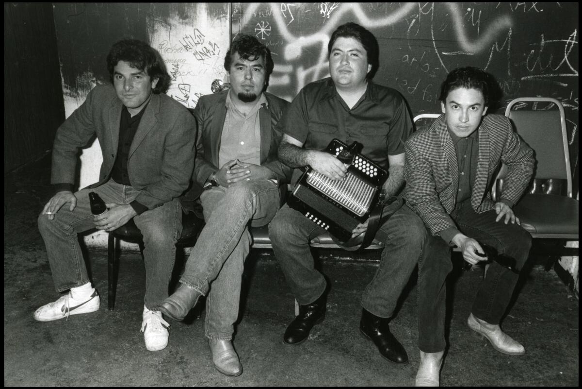 A black-and-white photo of Los Lobos members Conrad Lozano, left, Cesar Rosas, David Hidalgo and Louis Pérez in 1982. 