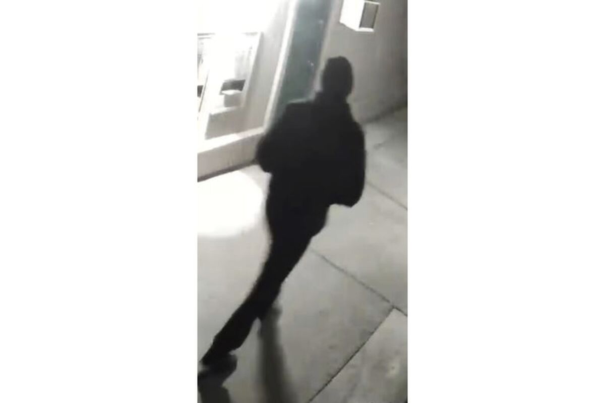 In this undated surveillance image released by the Stockton Police Department, a person is shown from behind, in Stockton, Calif. Rewards totaling $85,000 have been offered for information leading to an arrest in five fatal shootings since July in Stockton, California, that investigators believe are related, police said. After reviewing surveillance footage, detectives have located an unidentified “person of interest” in the killings, Stockton Police Chief Stanley McFadden wrote on the department’s Facebook page. Police released a grainy still image of an individual filmed from behind, dressed all in black and wearing a black cap. (Stockton Police Department via AP)