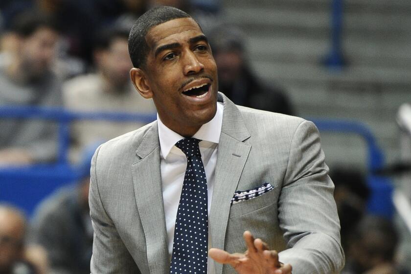 Connecticut Coach Kevin Ollie instructs his players during a win over Southern Methodist on March 1.