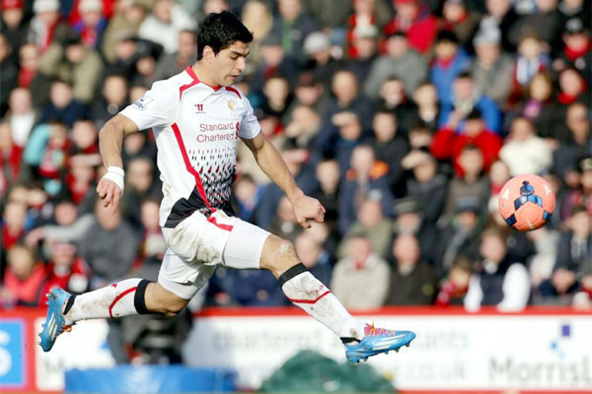 Liverpool's Luis Suarez controls the ball during an English FA Cup match against AFC Bournemouth on Saturday. Suarez has scored goals on nearly a quarter of his shots.