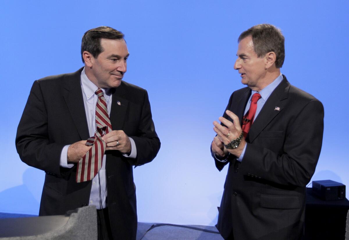 Indiana Senate candidates Democrat Joe Donnelly, left, and Republican Richard Mourdock talk after participating in a debate in Indianapolis.