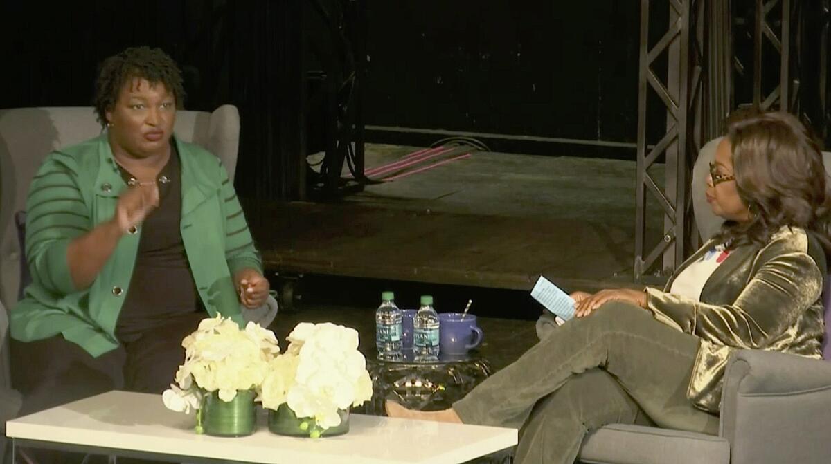 In this image made from video, Georgia Democratic gubernatorial nominee Stacey Abrams, left, speaks with Oprah Winfrey, Thursday, Nov. 1, 2018, in Marietta, Ga.