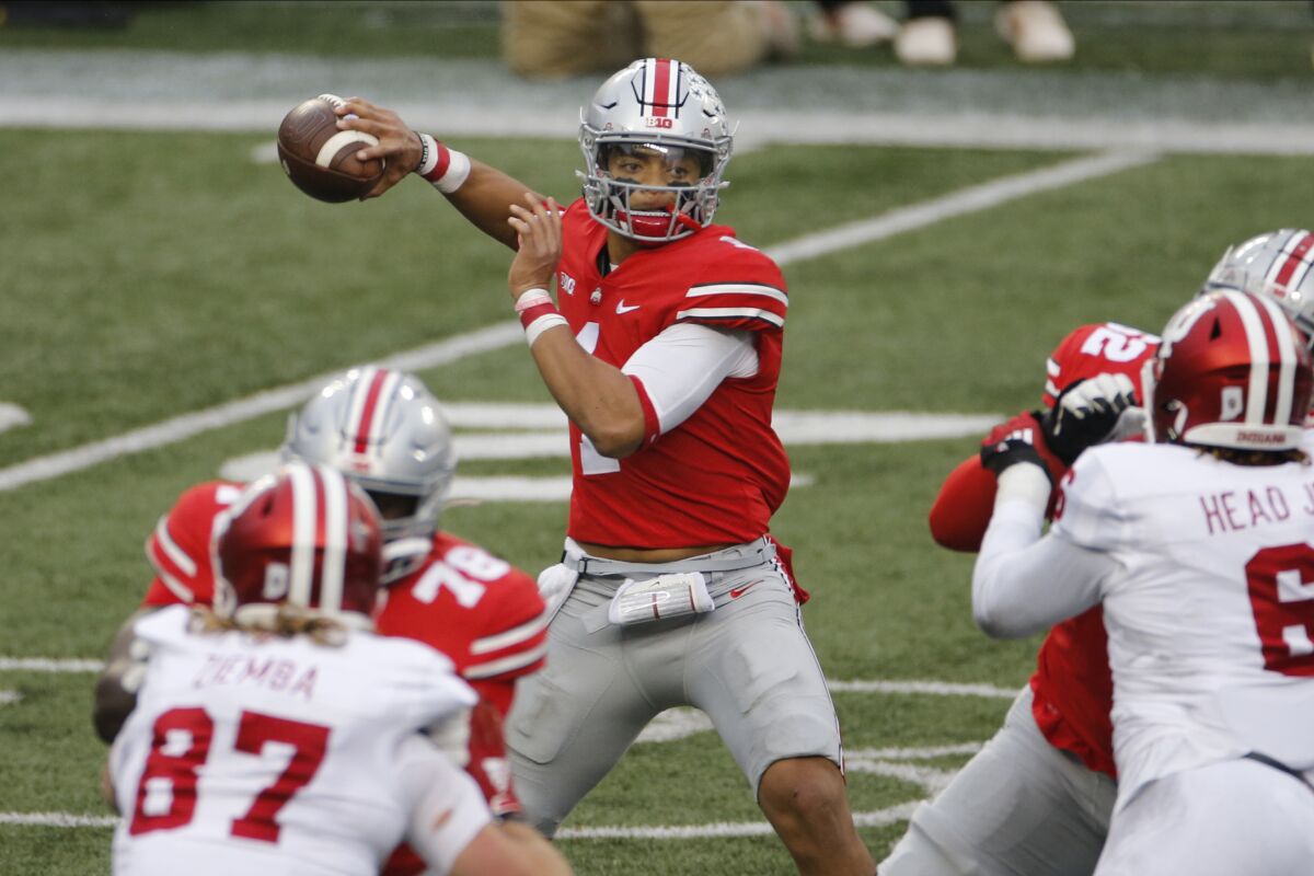 Ohio State quarterback Justin Fields throws a pass against Indiana during the first half of an NCAA college football game Saturday, Nov. 21, 2020, in Columbus, Ohio. (AP Photo/Jay LaPrete)