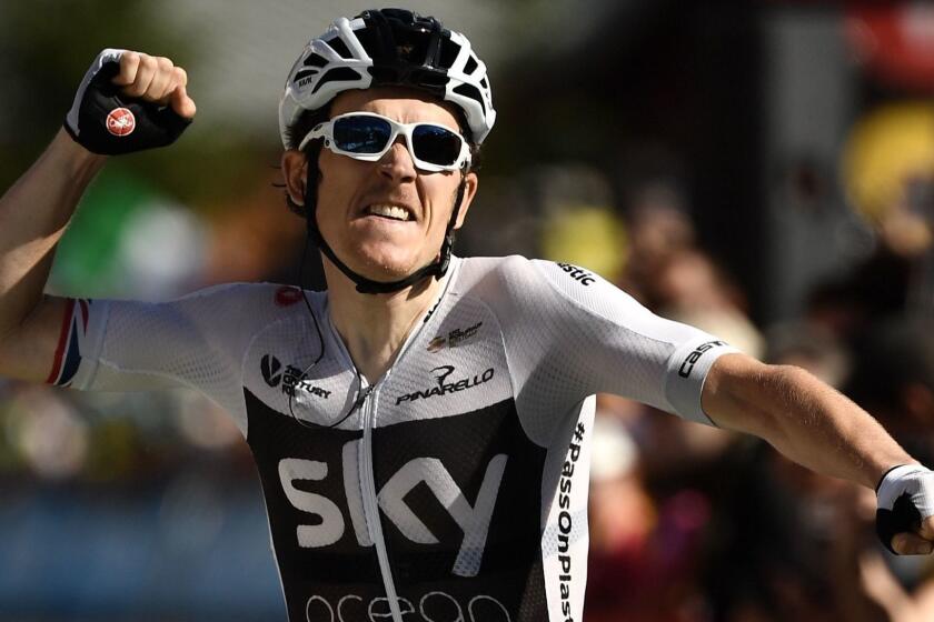 Great Britain's Geraint Thomas celebrates as he crosses the finish line to win the eleventh stage of the 105th edition of the Tour de France cycling race between Albertville and La Rosiere, French Alps, on July 18, 2018. / AFP PHOTO / Marco BERTORELLOMARCO BERTORELLO/AFP/Getty Images ** OUTS - ELSENT, FPG, CM - OUTS * NM, PH, VA if sourced by CT, LA or MoD **