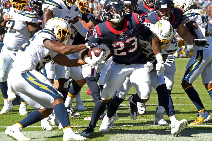 CARSON, CA - SEPTEMBER 22: Running back Carlos Hyde #23 of the Houston Texans rushed past defensive back Roderic Teamer #36 of the Los Angeles Chargers for a touchdown in the third quarter of the game at Dignity Health Sports Park on September 22, 2019 in Carson, California. (Photo by Jayne Kamin-Oncea/Getty Images)