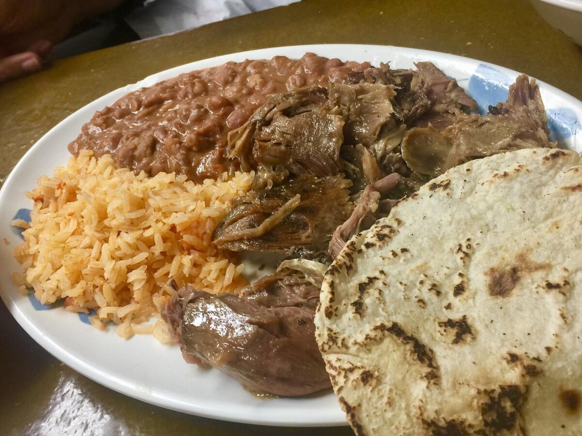 A plate of lamb and a tortilla make a terrific lamb taco at La Barbacha in Boyle Heights.