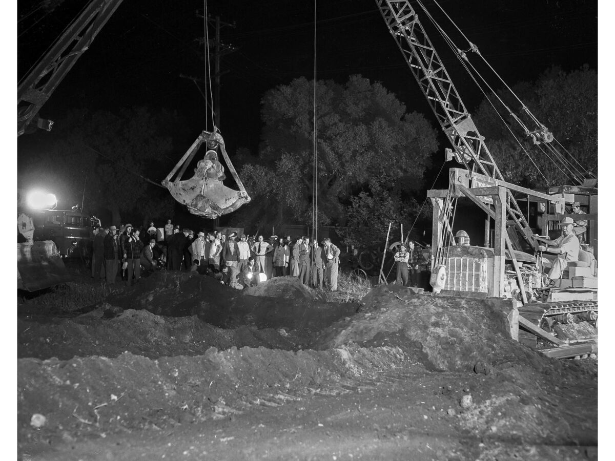 April 8, 1949: Clamshell cranes and bulldozers in action during efforts to rescue Kathy Fiscus, 3. This dig was later abandoned and a different hole was drilled.