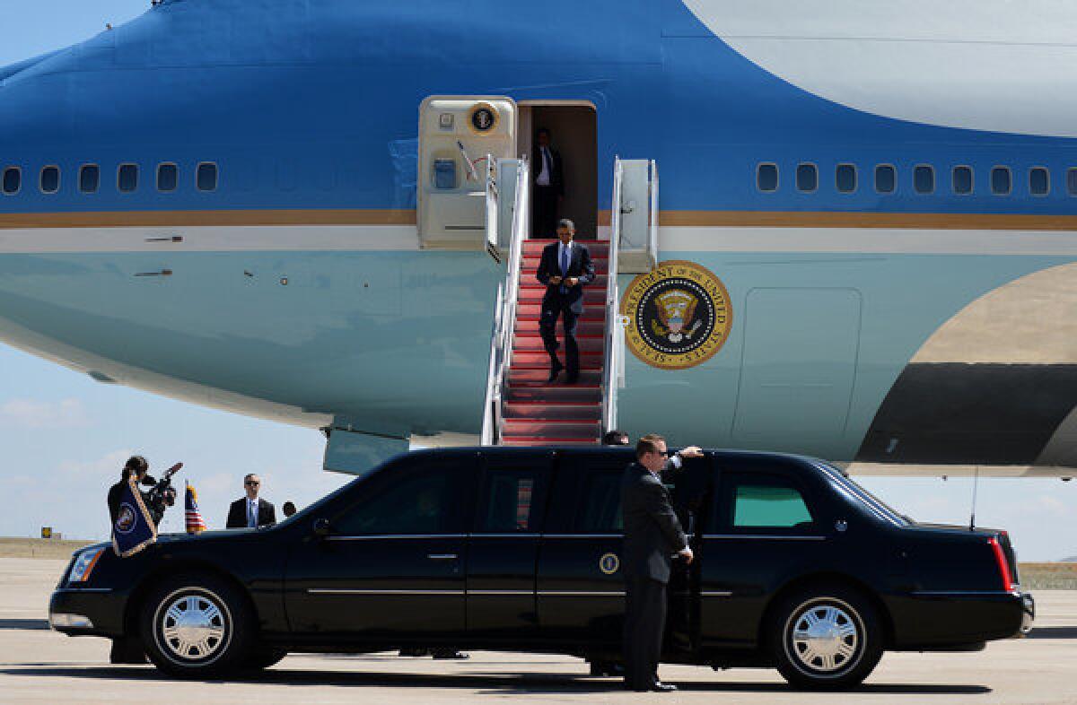 President Obama disembarks from Air Force One at Buckley Air Force Base in Denver. After his Colorado visit, he was to head to the San Francisco Bay Area.