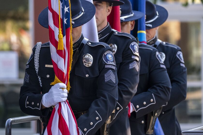 MURRIETA, CA - AUGUST 31: The Murrieta Police Department Honor Guard line up at the Town Square Park Amphitheater to honor three Southern California Marines, including two from Riverside County, who were among 13 service members killed in a suicide bombing at Hamid Karzai International Airport in Kabul on Tuesday, Aug. 31, 2021 in Murrieta, CA. On Tuesday, the city of Murrieta will honor all 13 service members who lost their lives in the Thursday bombing, including Cpl. Hunter Lopez, 22, of Indio, Lance Cpl. Kareem Mae'Lee Grant Nikoui, 20, of Norco, and Lance Cpl. Dylan Merola, 20, of Rancho Cucamonga. All three were assigned to 2nd Battalion, 1st Marine Regiment, 1st Marine Division, I Marine Expeditionary Force at Camp Pendleton. The "Remembrance Ceremony Honoring Fallen Service Members" (Francine Orr / Los Angeles Times)